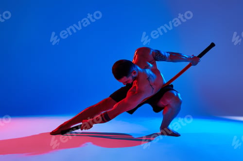 Preview: Animal instinct fitness instructor sportsman showing his incredible flexibility with an animal flow