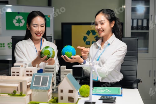 Preview: Two colleagues discussing data Construction Site project, green energy and solar panel concept.