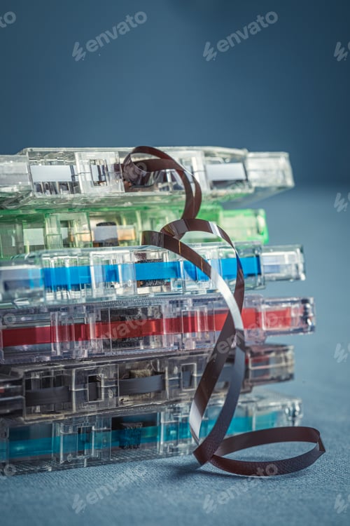 Preview: Pile of old cassette tapes with an extracted tape