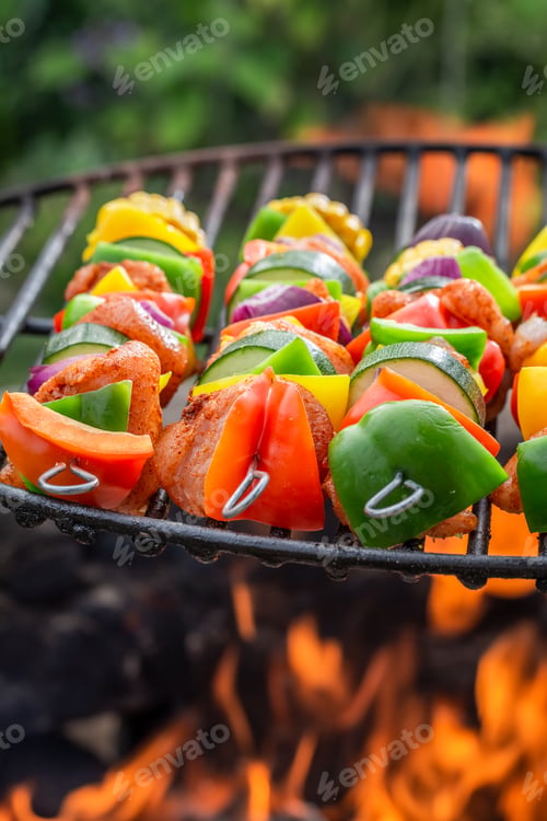 Preview: Closeup of skewers on grill with meat and vegetables