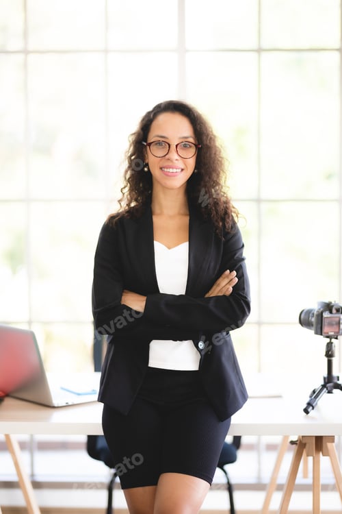 Preview: Confident Woman Wearing a Suit Poses Indoors