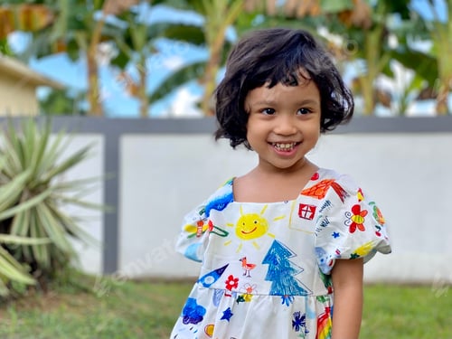 Preview: Kid smiling standing in the garden