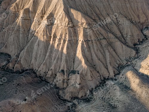 Preview: Aerial view of a mountain of earth with canals