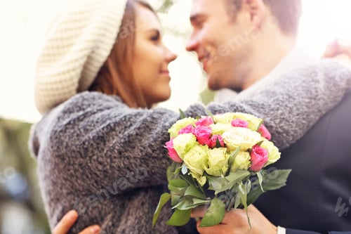 Preview: Young couple kissing in the park
