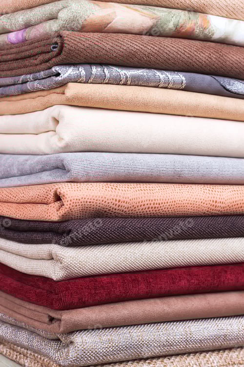 Preview: Stack of Folded Fabrics in Neutral Colors