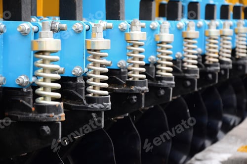 Preview: Spring system of agricultural seeder close up outdoors