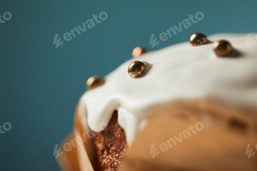 Preview: close up of easter cake decorated with sprinkles on turquoise with copy space