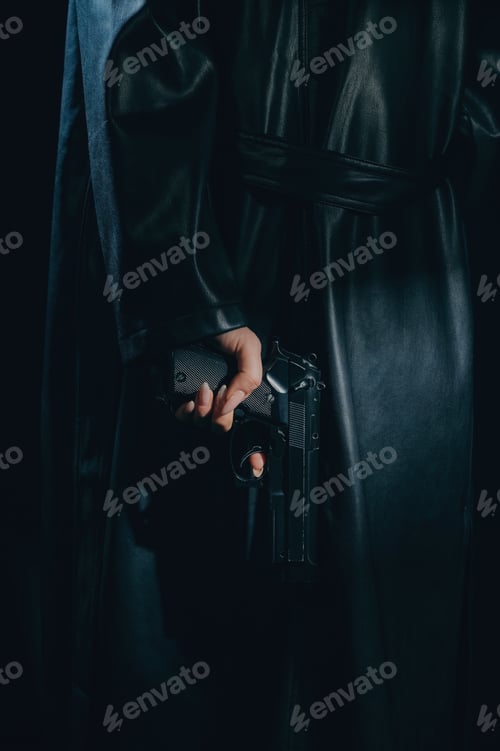 Preview: silhouette of a female detective in a coat with a gun in her hands, which she hides behind her back
