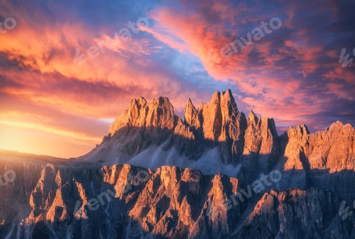 Preview: Rocky mountains at amazing colorful sunset in summer in Dolomites