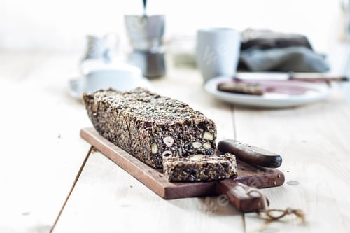 Preview: Home-baked wholemeal gluten-ree bread with nuts and seeds on wooden board