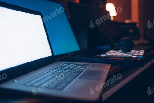 Preview: Close up on music production controller and computer