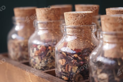 Preview: Spices in jars on a wooden shelf in a kitchen
