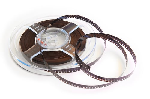 Preview: 8mm film isolated on white. Vintage movie and filmmaker