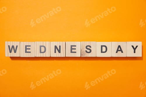 Preview: top view of wooden blocks with letters on orange surface