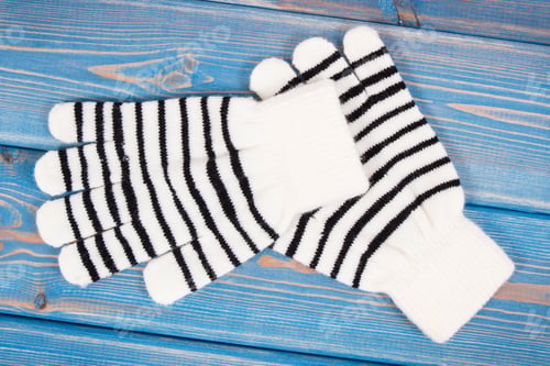 Preview: Striped gloves for woman on boards, clothing for autumn or winter concept