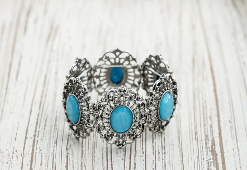 Preview: Bracelet With Blue Stones Isolated On Wood