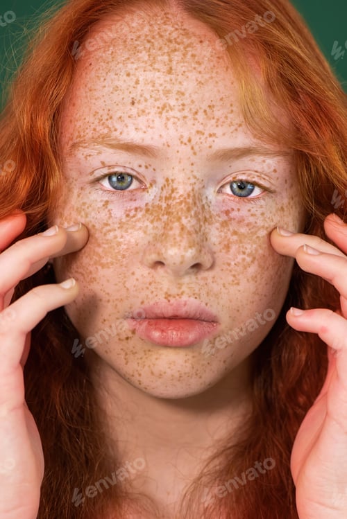 Preview: Portrait of a red-haired girl with freckles