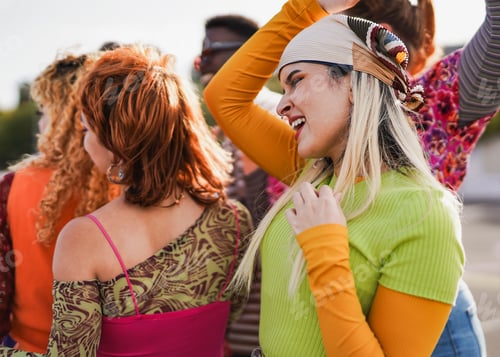 Preview: Group of young people dancing at music concert outdoor