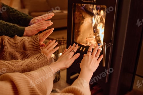 Preview: Hands Of People In Front Of Fireplace