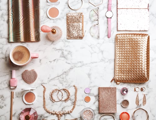 Preview: Frame made of accessories and decorative cosmetics on marble background, space for text