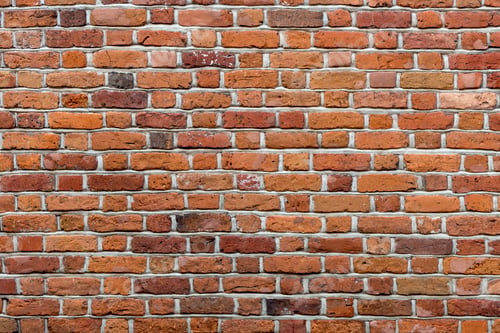 Preview: Natural old vintage weathered red brown solid brick wall. Abstract copy space background.