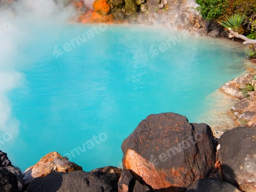 Preview: Lava rocks beside turquoise color hot spring