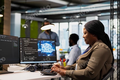 Preview: System administrator in office using AI automation scripts