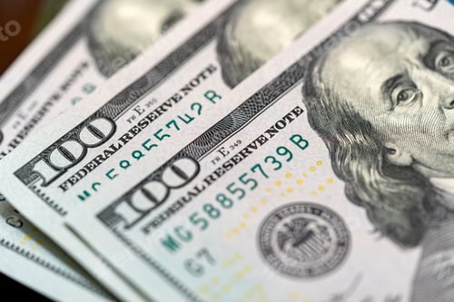 Preview: Top view of 100 dollar bills with the face of Benjamin Franklin