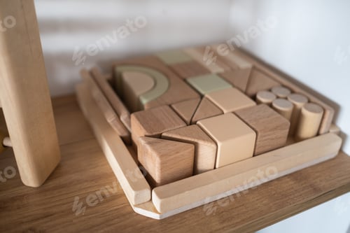 Preview: A shelf with children's wooden toys in the children's room. Children's concept