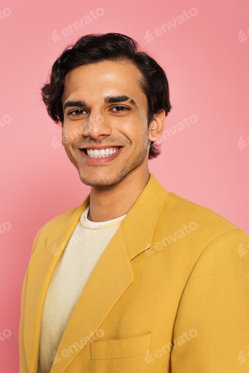 Preview: joyful young man in trendy blazer isolated on pink