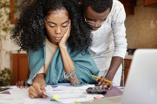 Preview: People, family budget, finances and payments concept. African-American man wearing glasses helping h