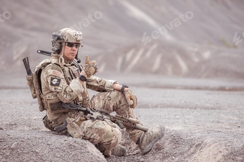 Preview: Soldiers in camouflage military uniforms carrying weapons Reconnaissance missions in rugged mountain