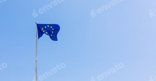 Preview: European Union EU flag is flying on blue sky background. Banner, place for text