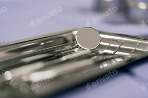 Preview: Close up view of a small mirror with handle in a dental clinic.