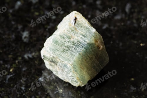 Preview: rough green sapphire corundum rock on black