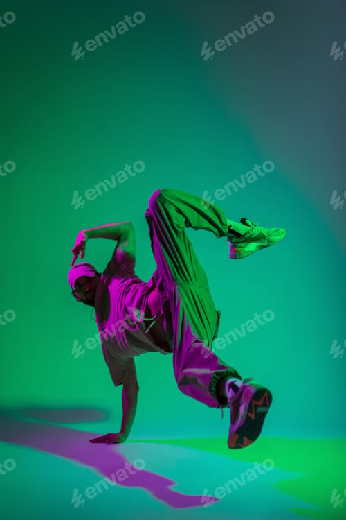 Preview: Handsome male dancer in fashionable clothes in studio