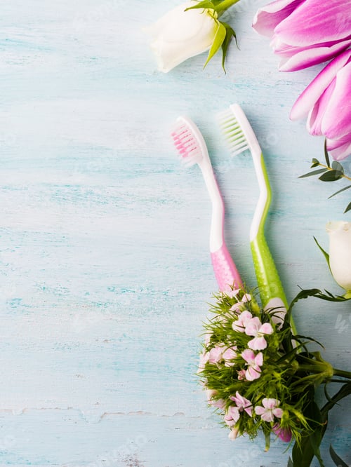 Preview: Two pastel toothbrushes with flowers herbs. Spring colors