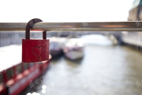 Preview: Red lock with a heart on a fence grate with an empty space as a symbol of love