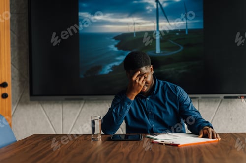 Preview: African american man feeling tired during energy presentation