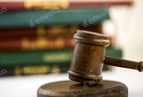 Preview: Judge gavel, scales of justice and law books in court