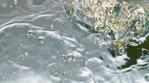 Preview: Tropical limes falling water closeup. Beautiful fresh organic fruits splashing