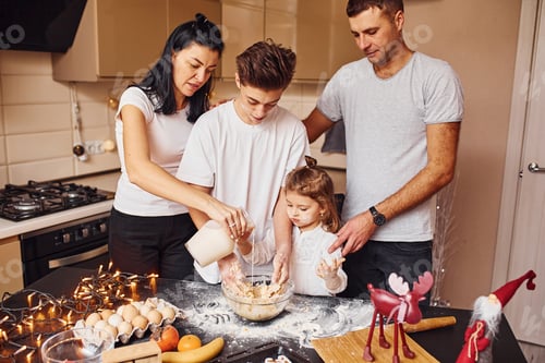 Preview: Happy family have fun on the kitchen and preparing food