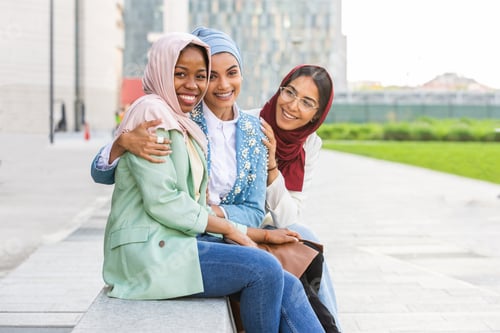 Preview: Beautiful muslim girl wearing hijab bonding outdoors