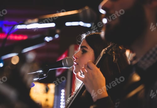 Preview: Guitarist during a musical performance.
