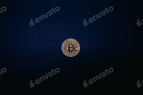Preview: Golden bitcoin coin isolated on blue dark background