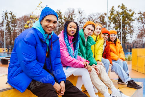 Preview: Multiracial group of young friends meeting outdoors in winter