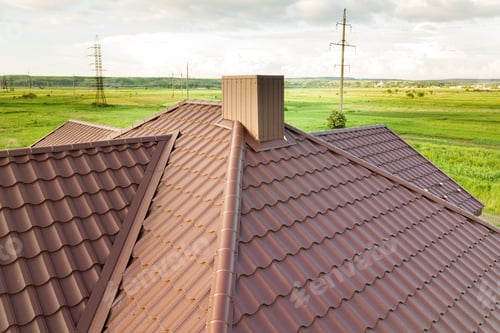 Preview: Aerial view of house roof structure covered with brown metal tile sheets