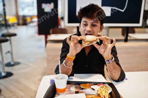 Preview: Indian man at fast food cafe