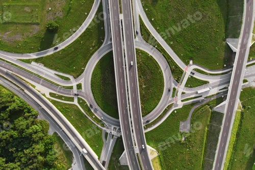 Preview: Cars moving on transport road junction in city, aerial view