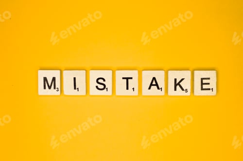 Preview: Mistake scrabble letters word on a yellow background